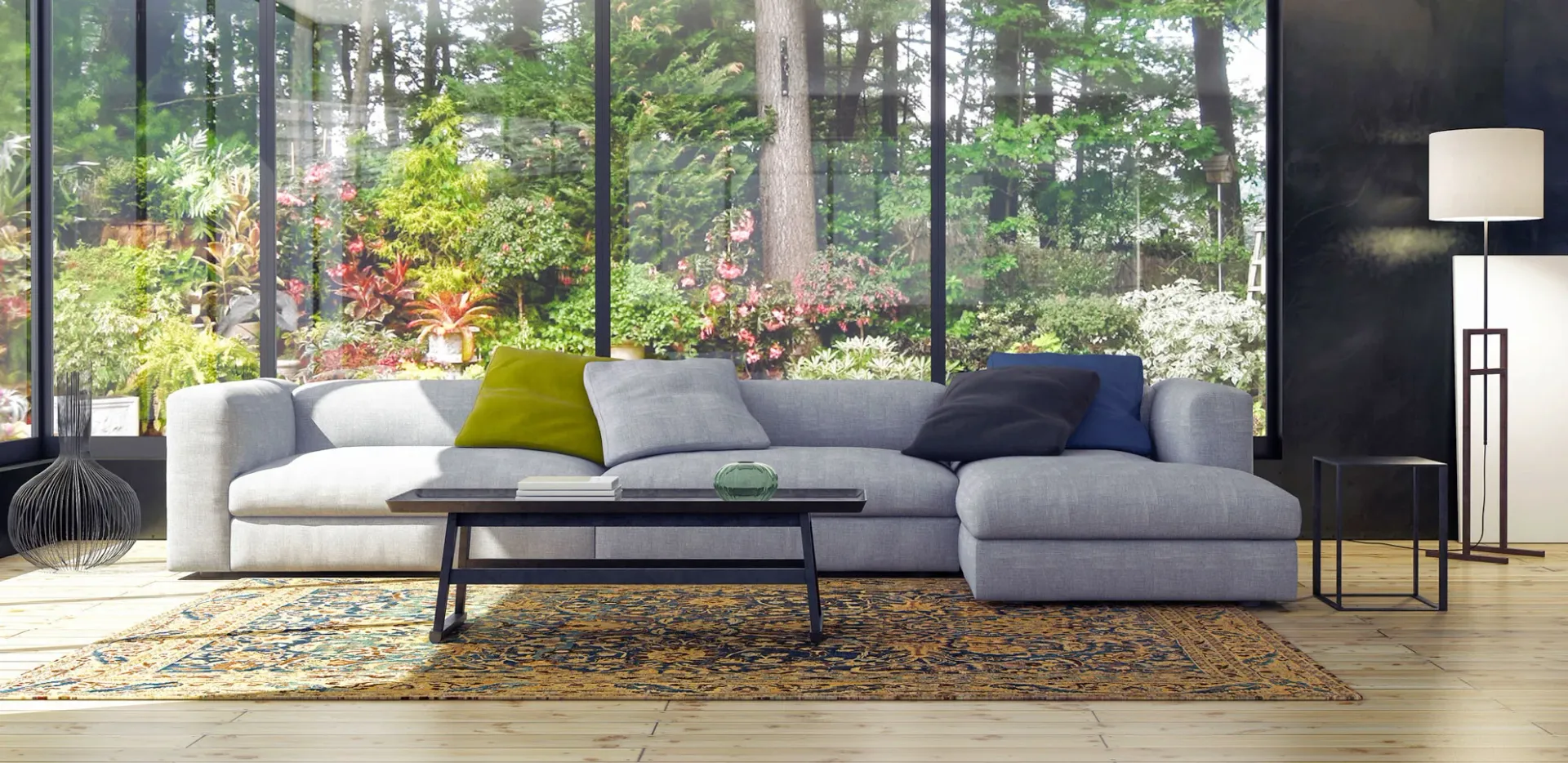 A modern sectional sofa in a bright living room with floor-to-ceiling garden views.